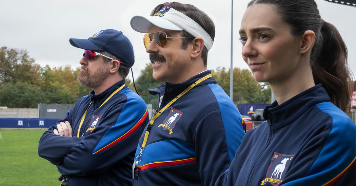 Coach Beard, Ted Lasso, and Tanya Reynolds on the sideline