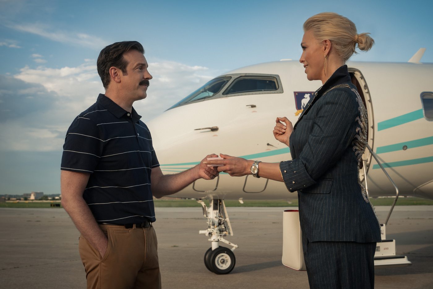 Ted Lasso and Rebecca Welton talking in an office
